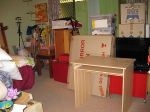This is Angela's bedroom. Wait until it's painted and organized! 